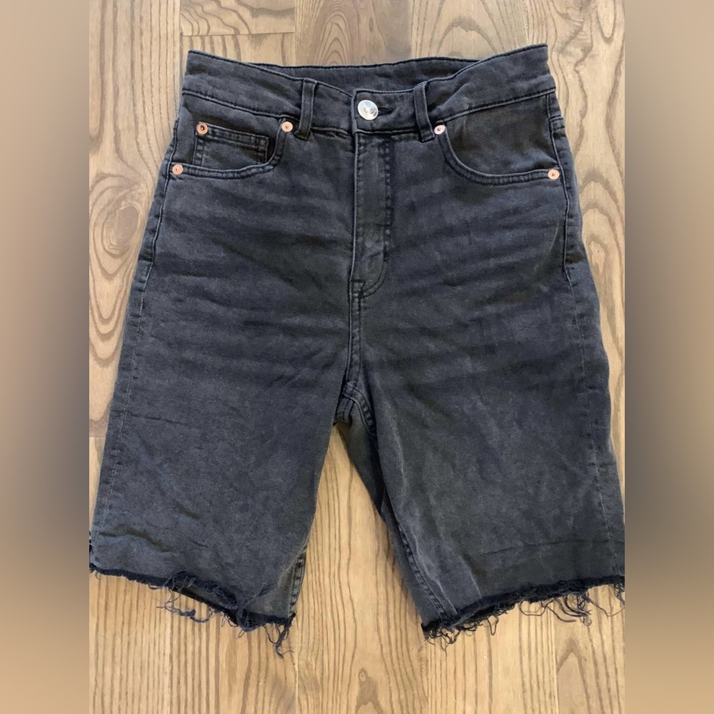 Faded black long cut-off jean shorts